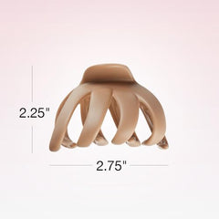 Beige and green Scunci clip in use secures a thick ponytail.