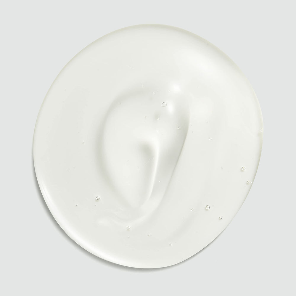 Sebastian Dark Oil Shampoo bottle on vanity with soft lighting, suggesting premium fragrance.