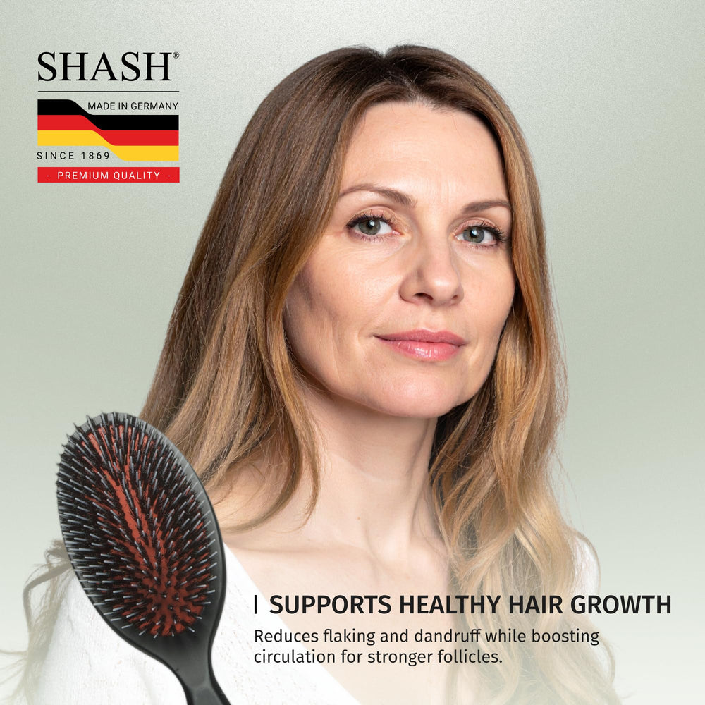 SHASH natural oil distribution by boar bristle brush on hair ends.