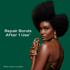 Close-up of SheaMoisture Bond Repair Shampoo label highlighting ingredients.
