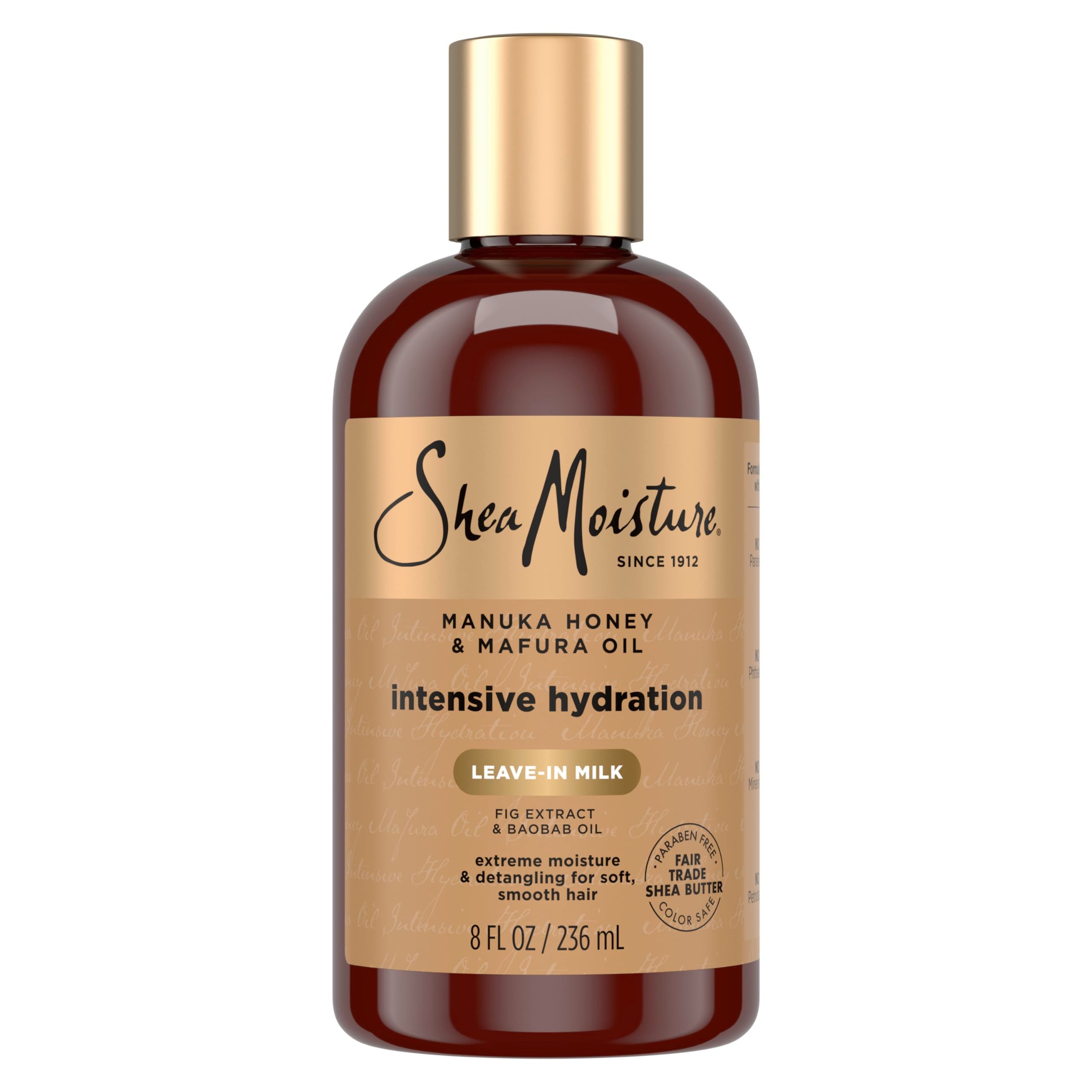 Botella SheaMoisture leche hidratante para cabello con miel de Manuka y aceite Mafura, hidratación suave.