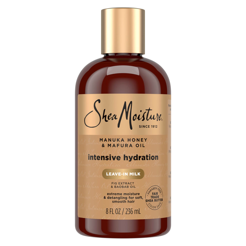Botella SheaMoisture leche hidratante para cabello con miel de Manuka y aceite Mafura, hidratación suave.