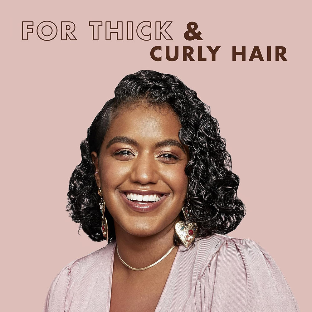 SheaMoisture Coconut Hibiscus conditioner close-up emphasizes detangling and softness.