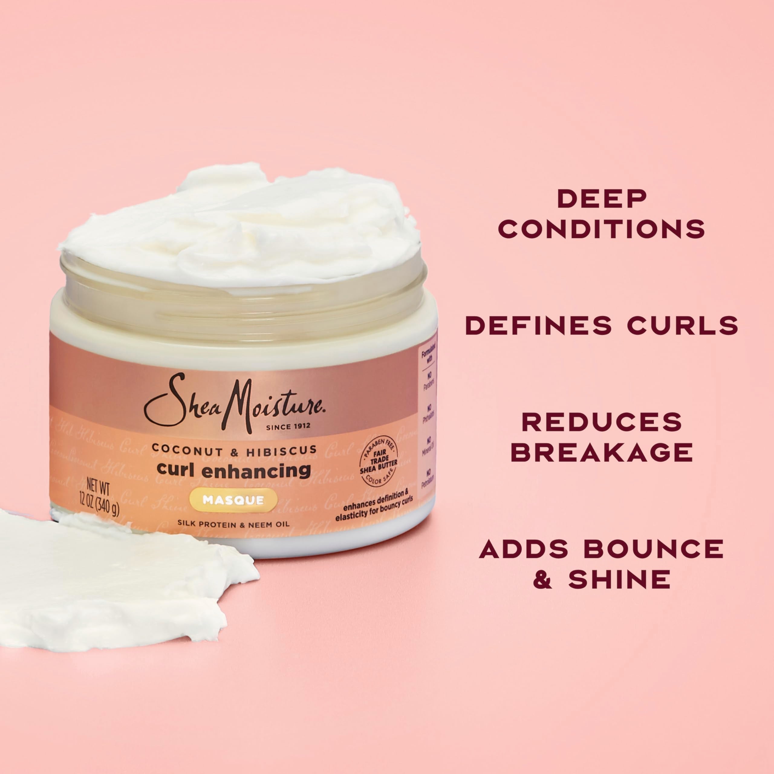 SheaMoisture Coconut and Hibiscus hair mask on damp curls for frizz control.