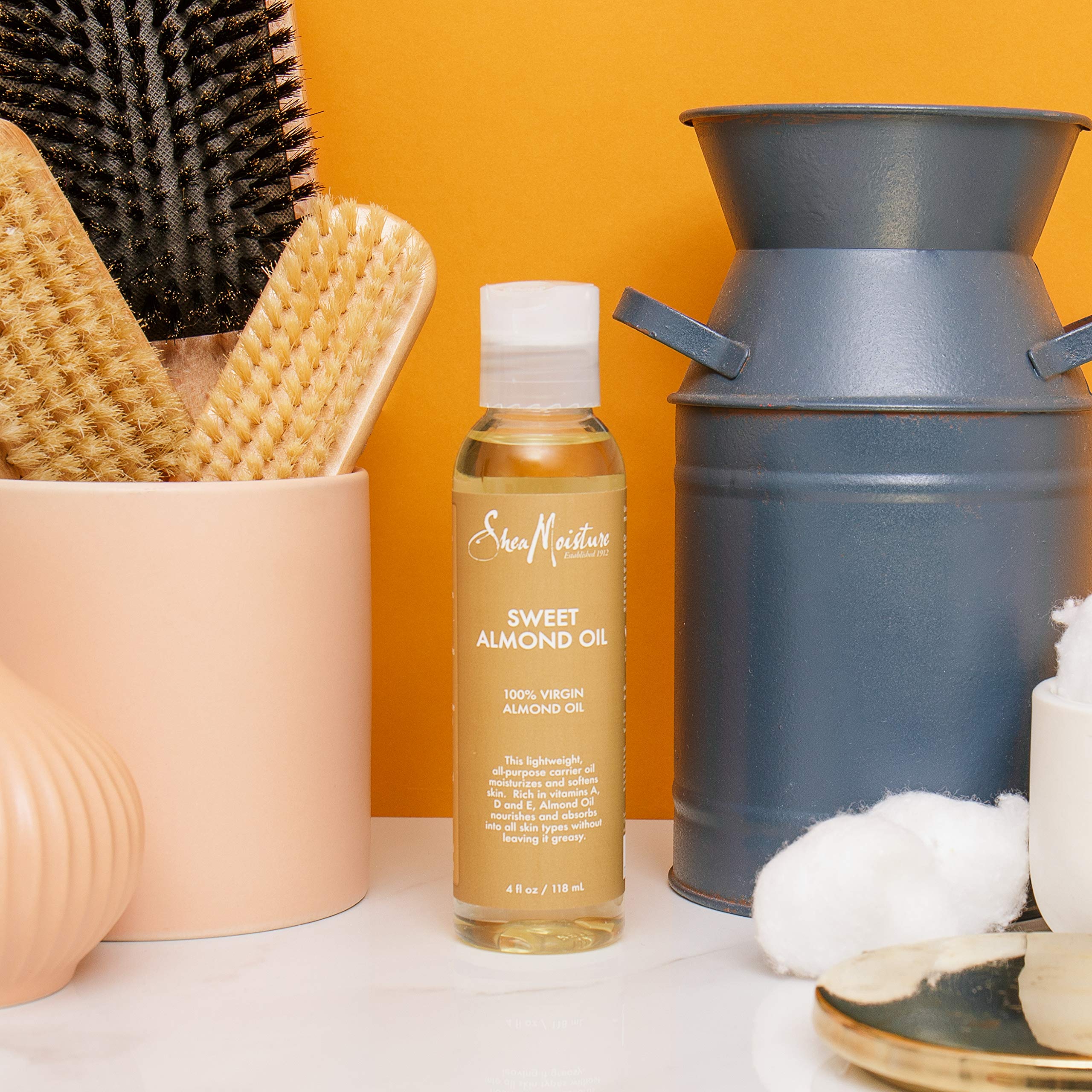 Bath scene with almond oil delivering soothing, non-greasy hydration.
