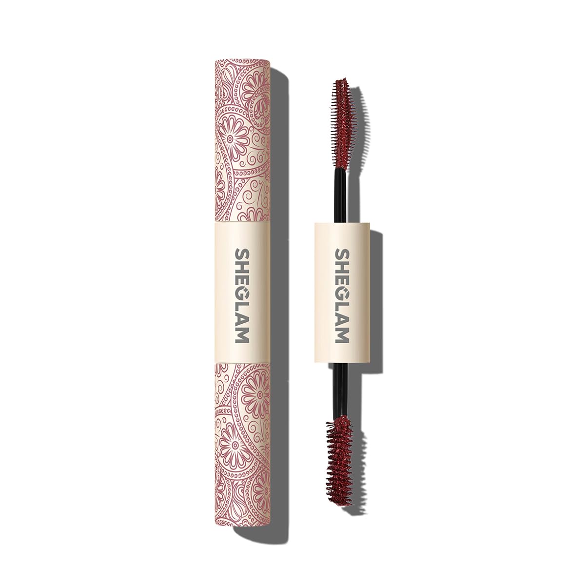 SHEGLAM All-In-One mascara application close-up showing burgundy shade for bold color payoff.