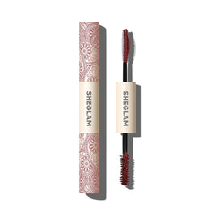 SHEGLAM All-In-One mascara application close-up showing burgundy shade for bold color payoff.