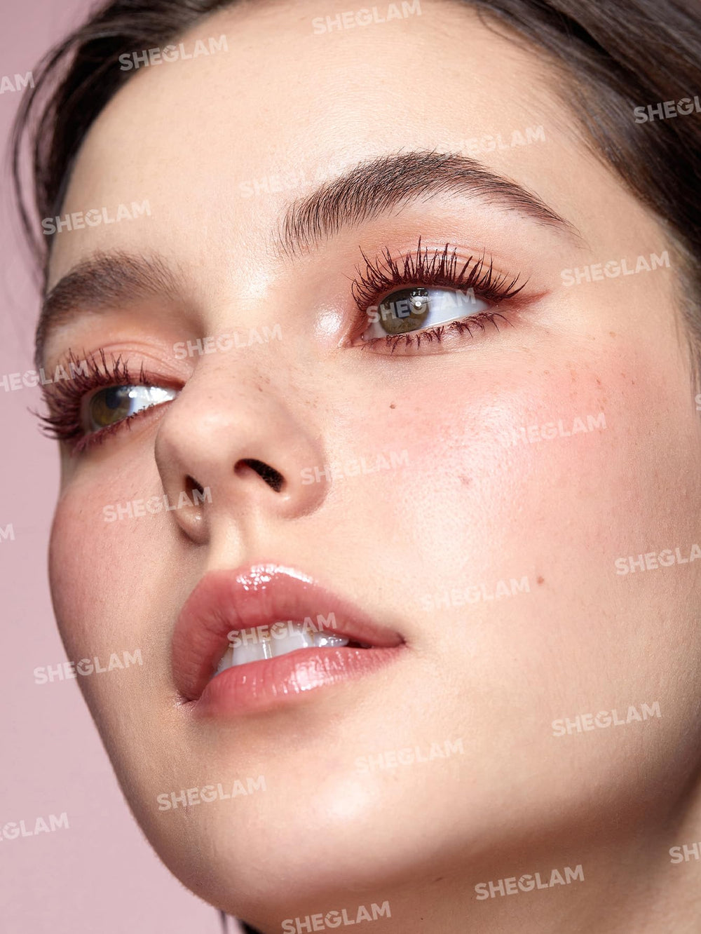 SHEGLAM mascara brush-head close-up demonstrates curved lift for defined lashes.