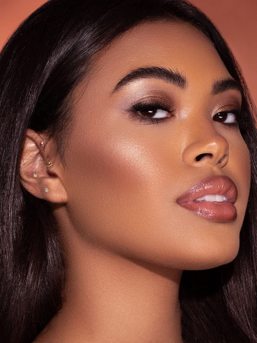 SHEGLAM Glow Bloom highlighter swirled on cheek for luminous glow
