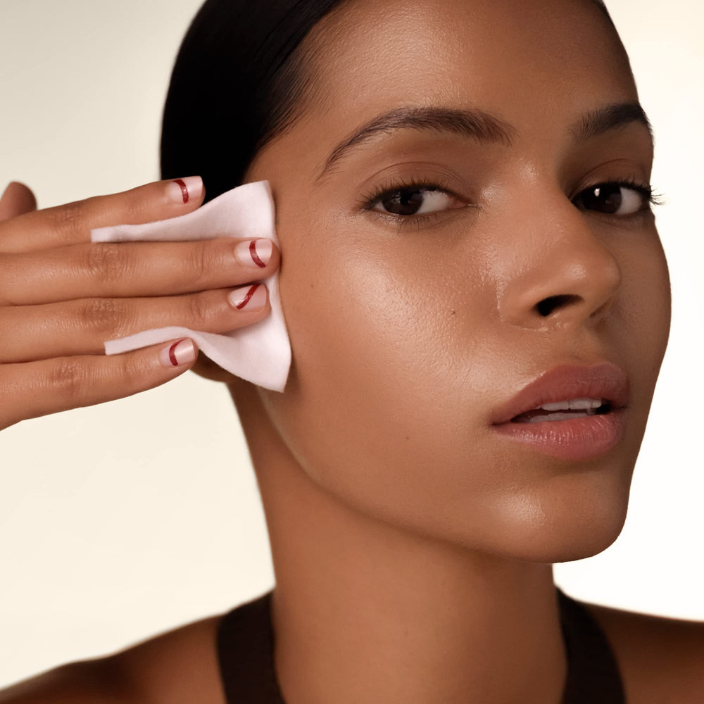 Shiseido facial cotton pads used for makeup removal with a soft touch.