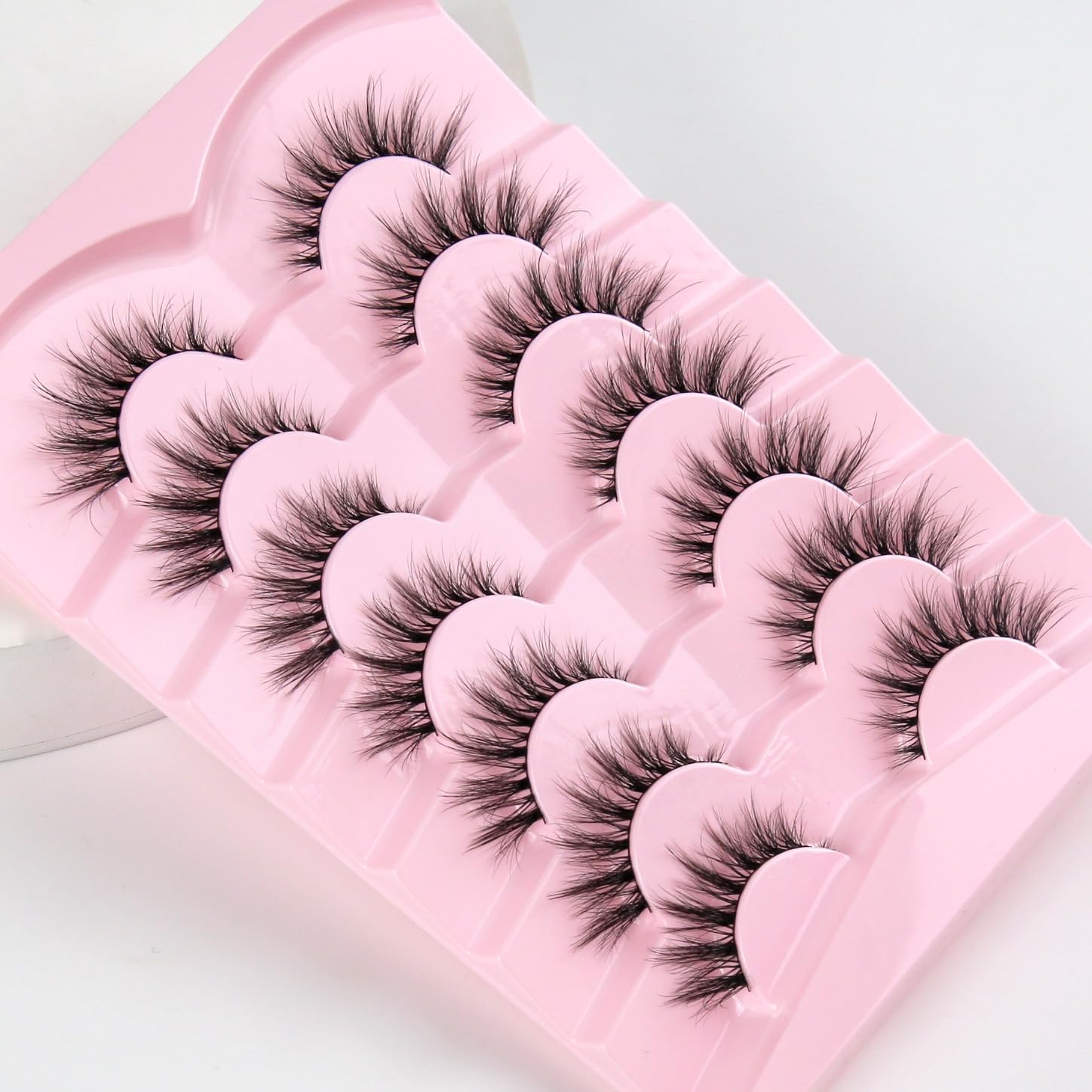 Siligli vegan, reusable pack with seven pairs for daily or on-the-go touch-ups.