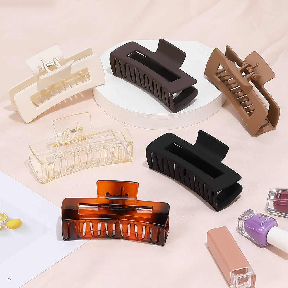 Pinza Sisiaipu para cabello cuadrado grande en negro, agarre seguro y duradero.