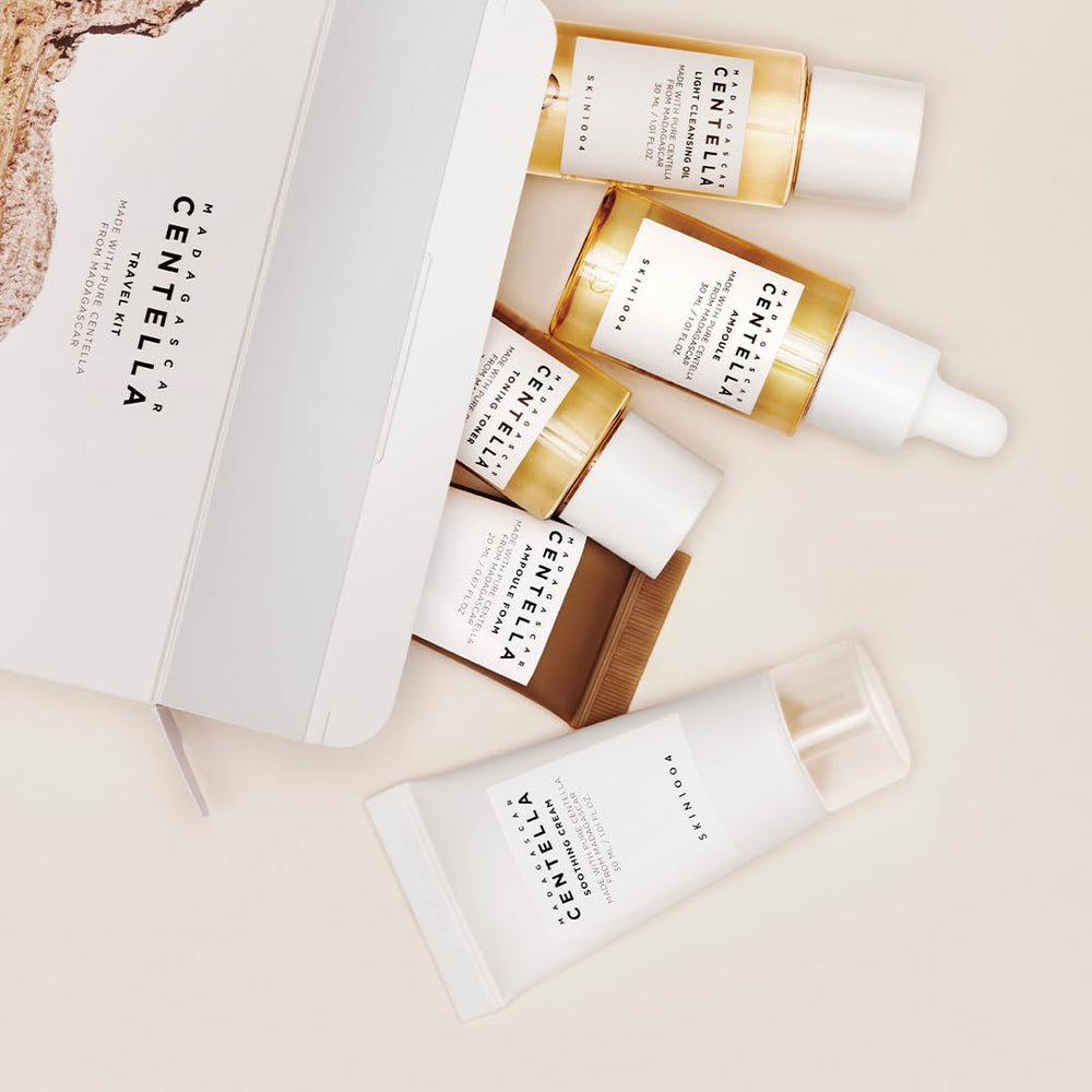 SKIN1004 mini skincare set placed on a plane tray for travel
