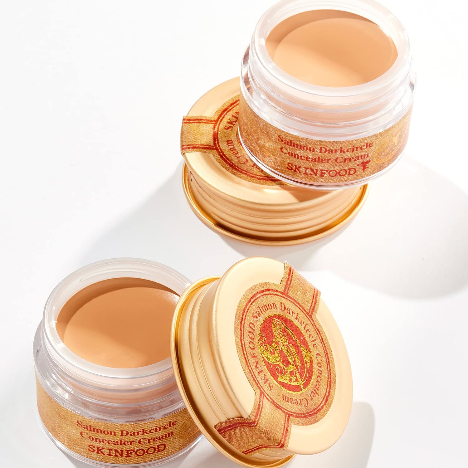 SKINFOOD Salmon Concealer after-glow look on skin for a refreshed appearance.