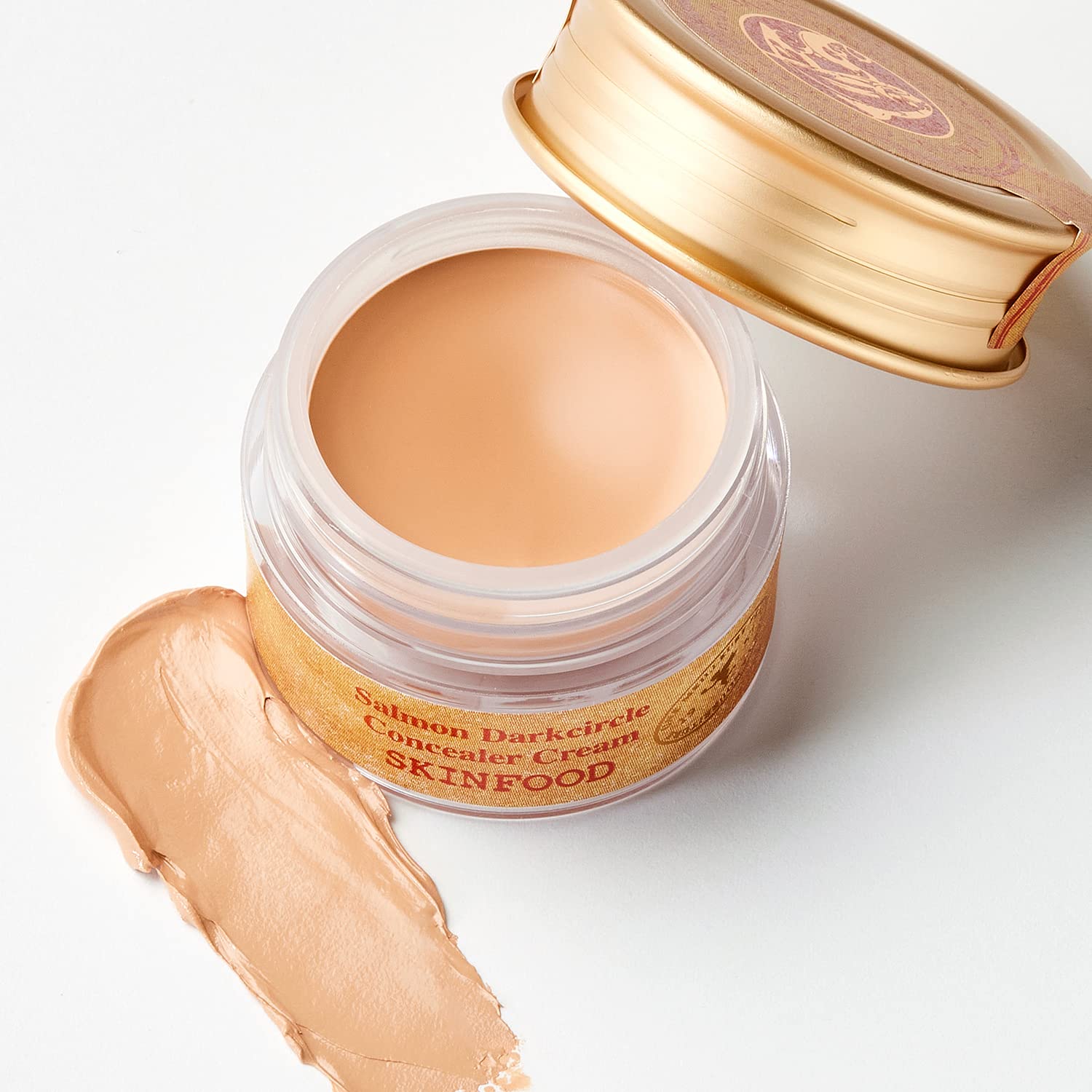 SKINFOOD Salmon Concealer swirl texture indicating full-coverage finish.