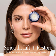 Hands applying SKINN balm around the eye area for night use