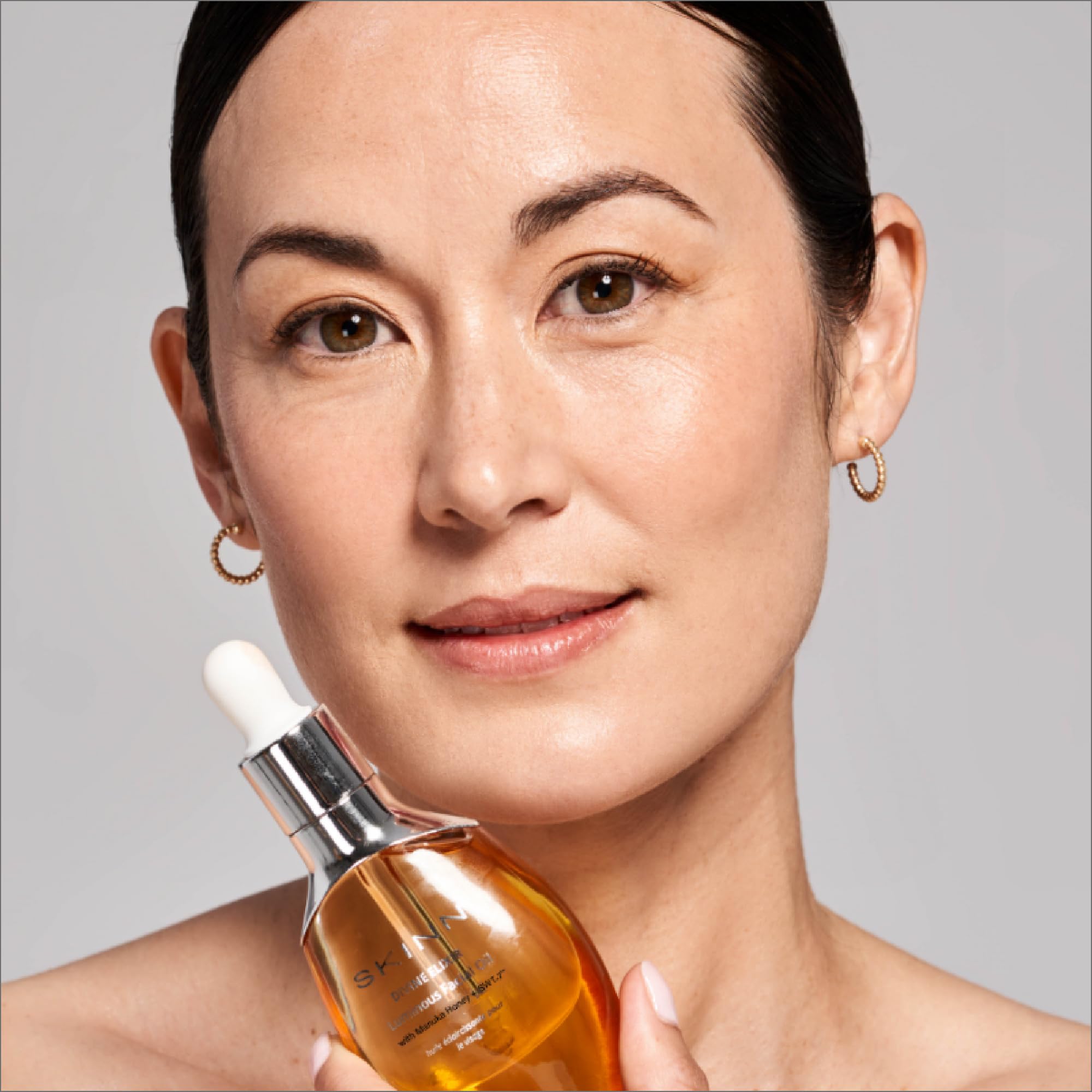 Applying SKINN face oil as part of a daily routine