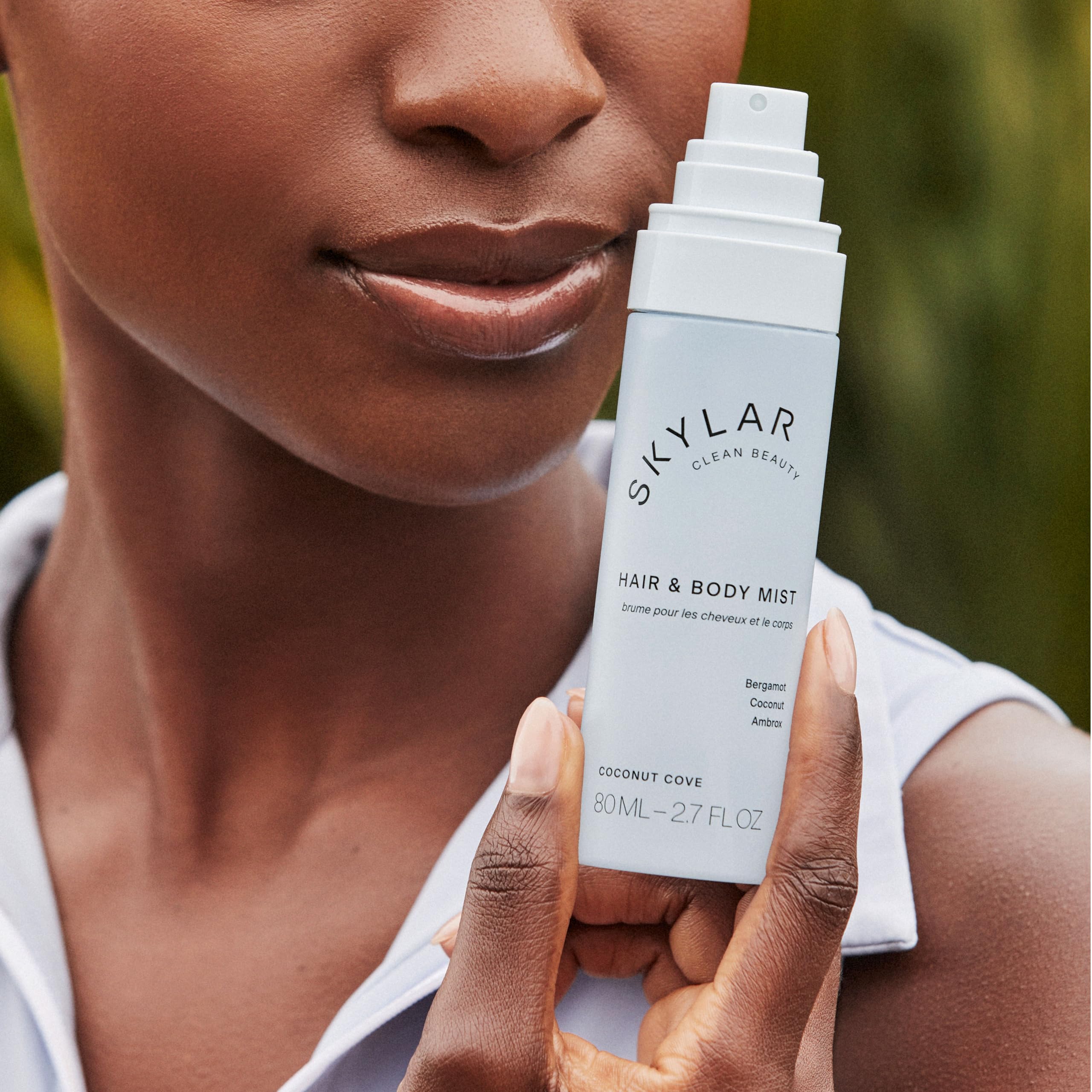 Skylar Coconut Cove application on hair for subtle aroma boost.