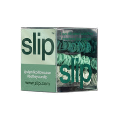 Slip mint skinny scrunchie closeup emphasizes glossy silk and secure feel.