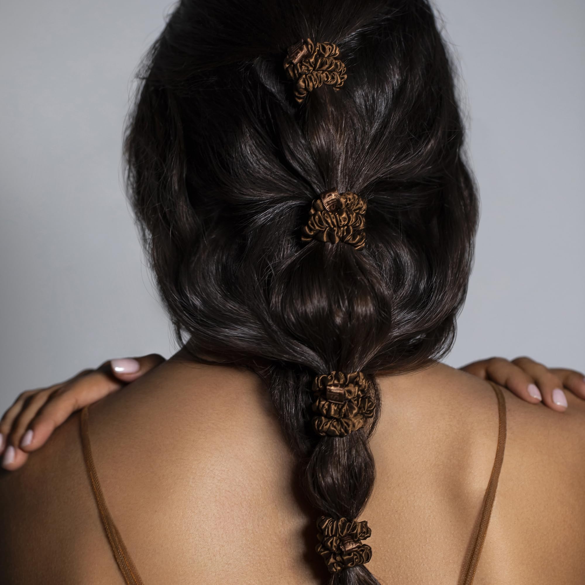 SLIPSILK care tips image illustrating gentle hand wash for silk scrunchies.
