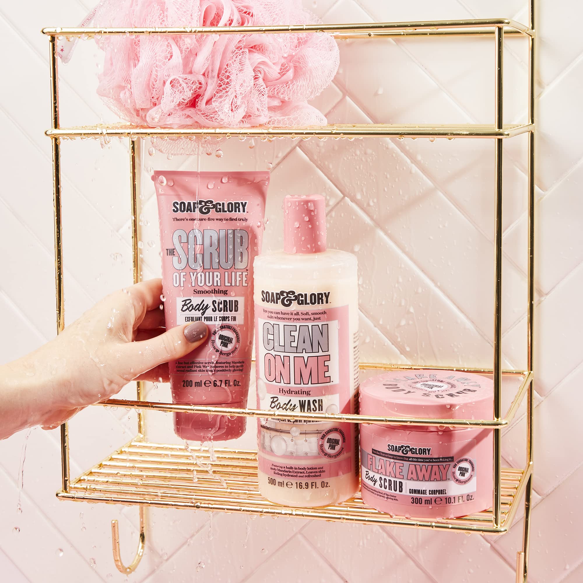 Fragrance swirls in Soap & Glory Original Pink Scrub jar with bergamot and rose notes.