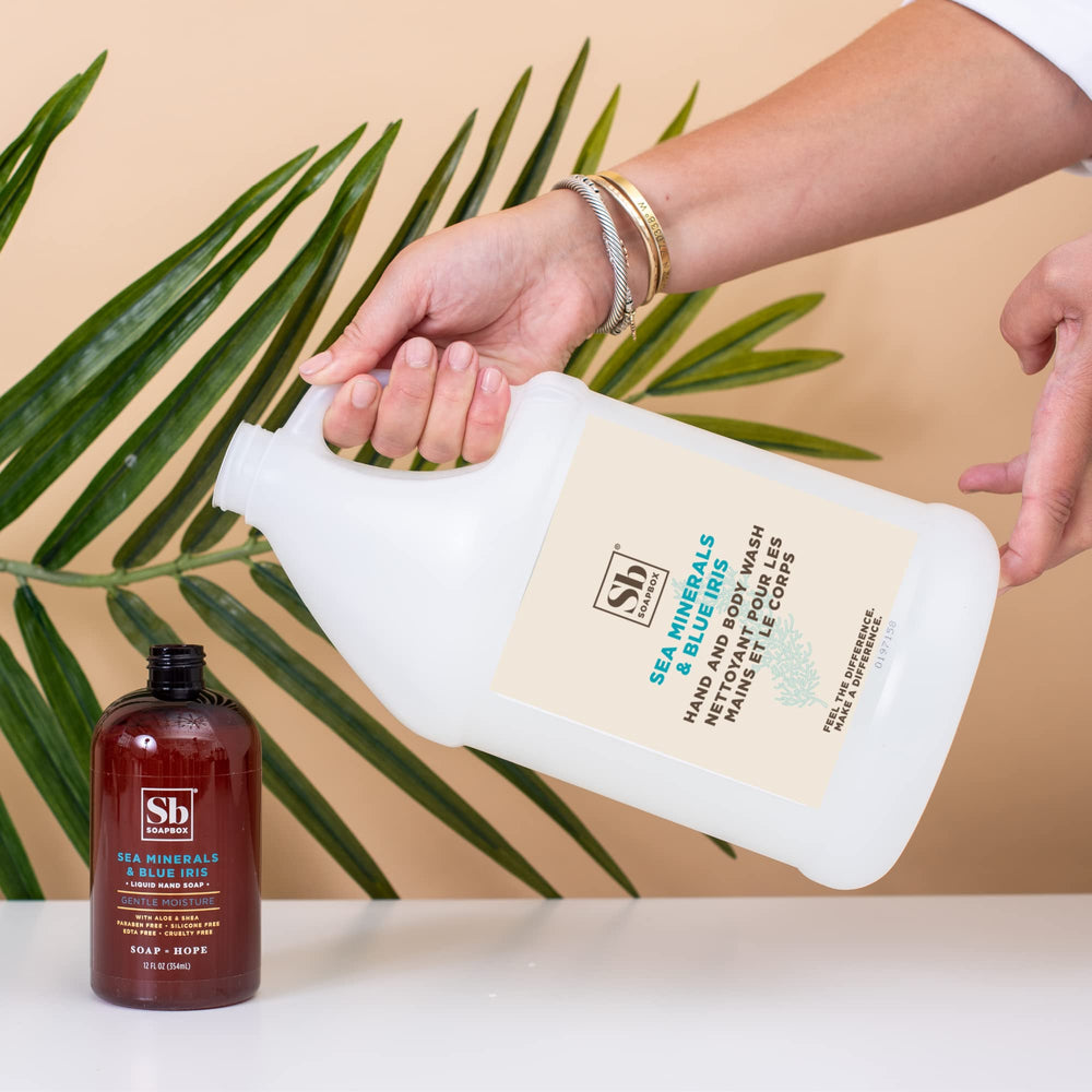 Soapbox Sea Minerals Blue Iris hand wash on hands with nourishing moisture.