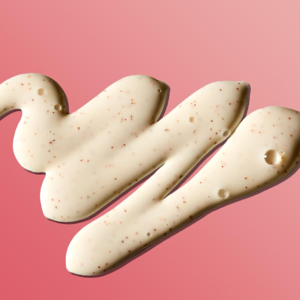 Softsoap coconut butter scrub near apricot seeds emphasizes exfoliation.