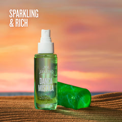 Sol de Janeiro mist bottle in hand for easy on the go refreshment.