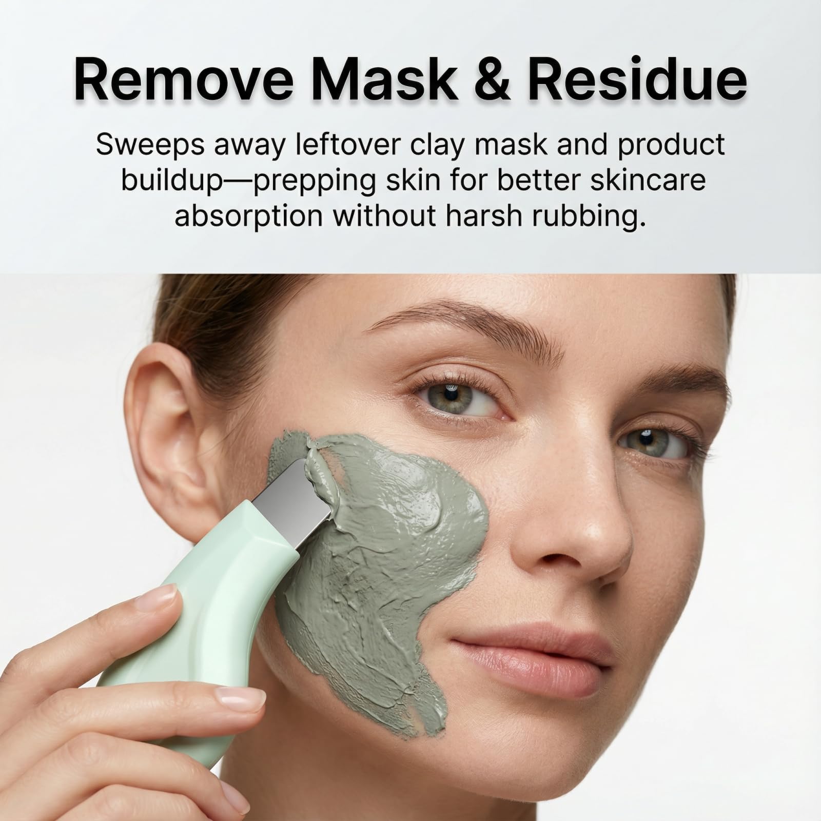 Silicone cover removed exposing stainless steel scraper for deep cleansing.