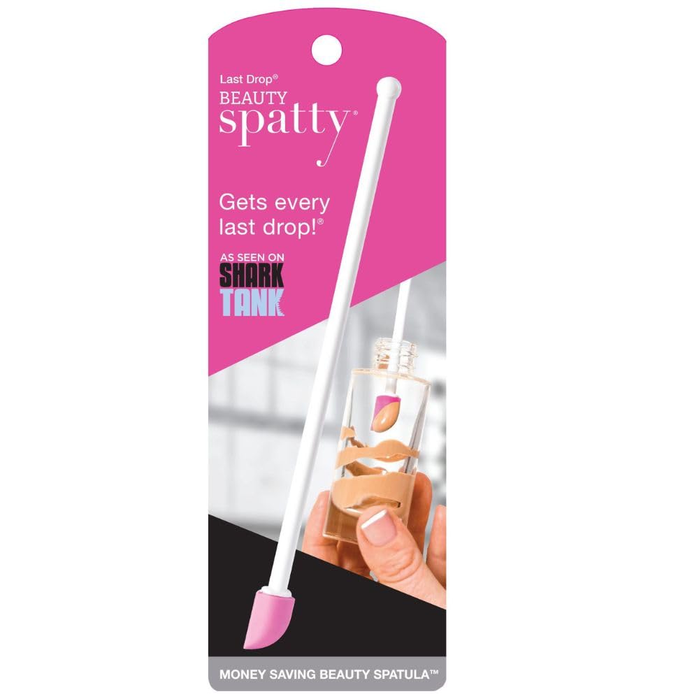 Spatty Daddy pink 6-inch spatula beside a jar, retrieves last drop and reduces waste.