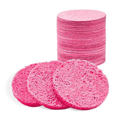 Spunspon pink round facial sponge for gentle cleansing and makeup removal.