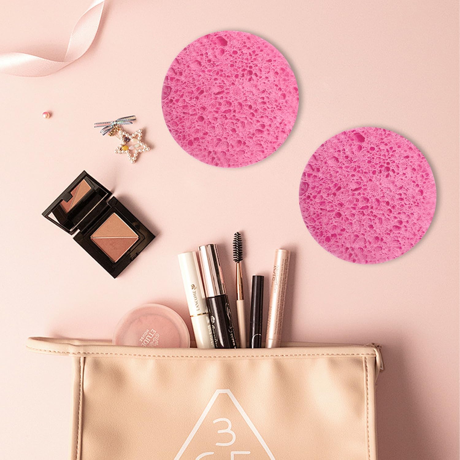 Spunspon pink round facial sponge ready for travel with compact size.