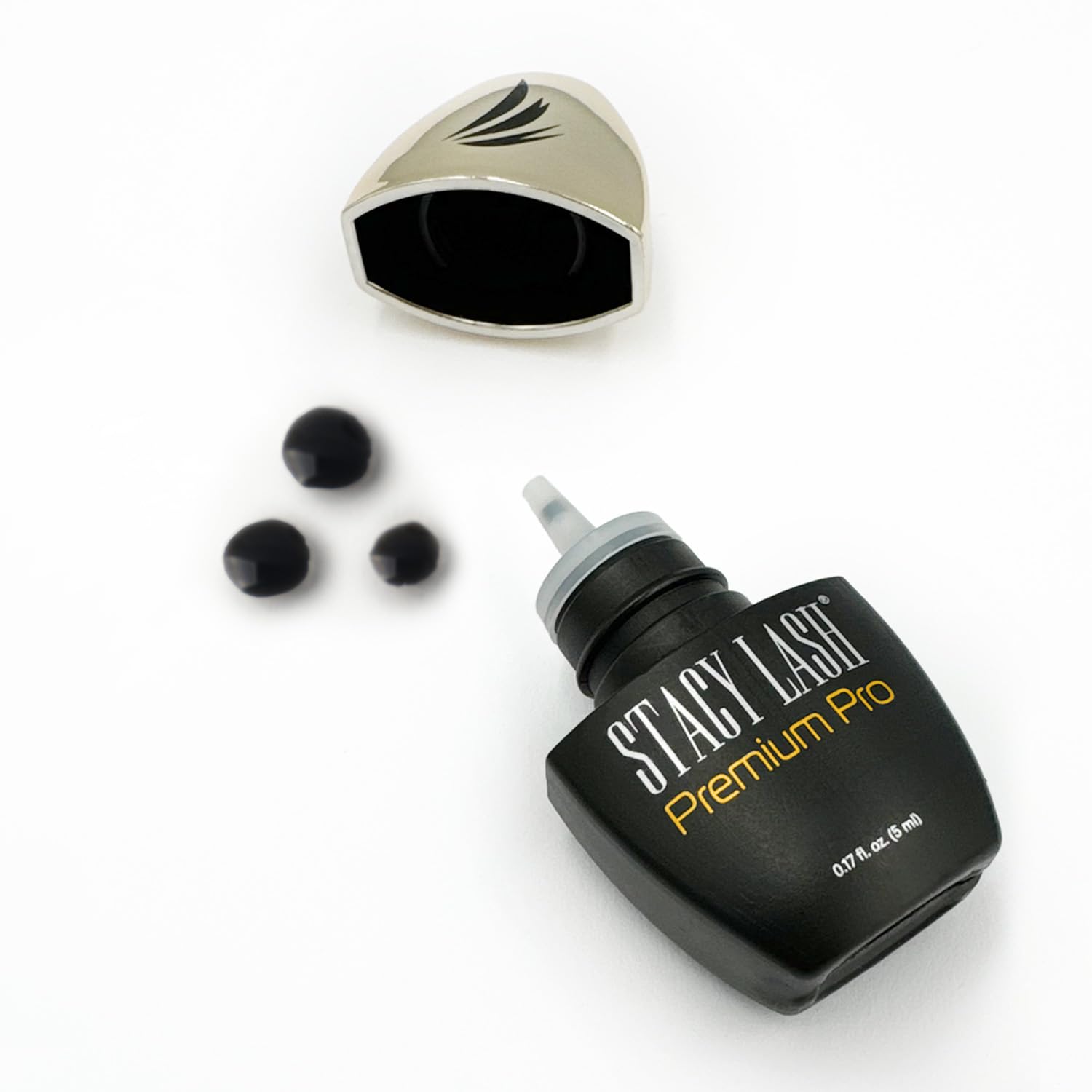 Stacy Lash Premium Pro glue sits in a sleek display-ready bottle