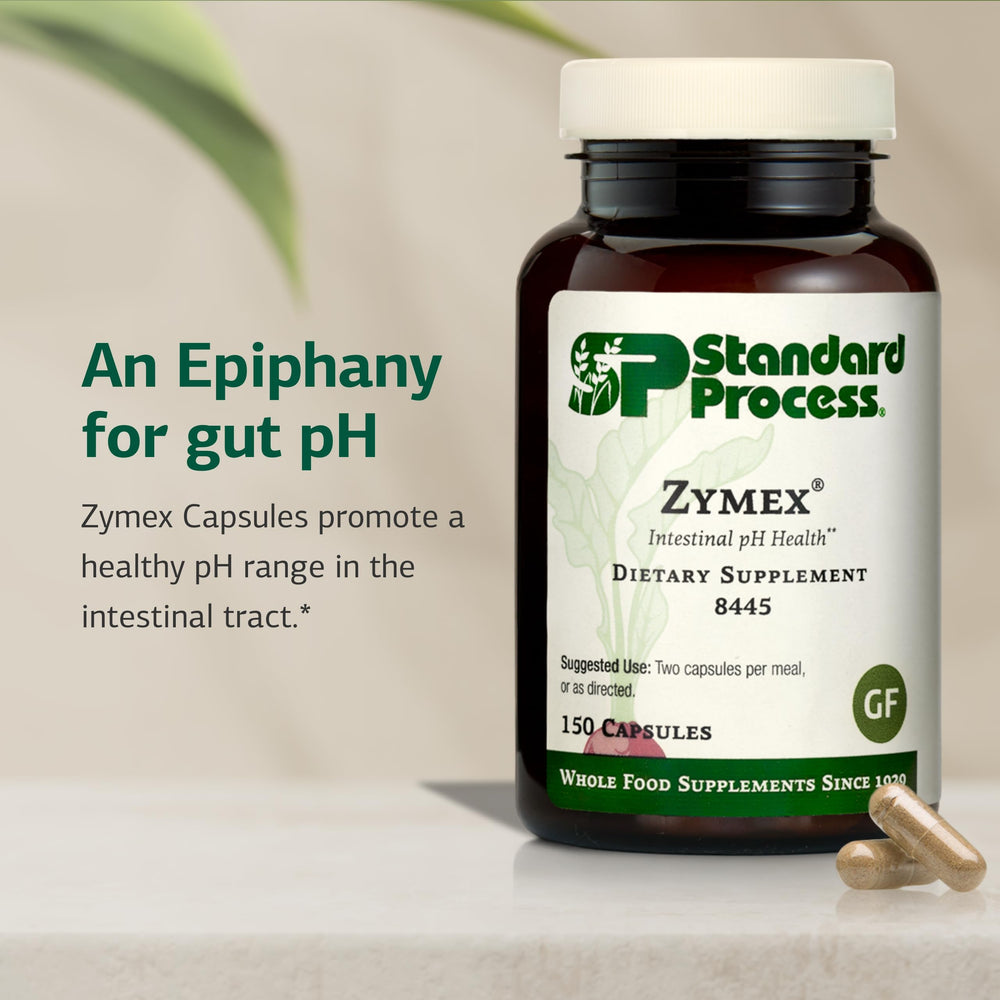 Standard Process Zymex capsules pouring into glass for daily use.