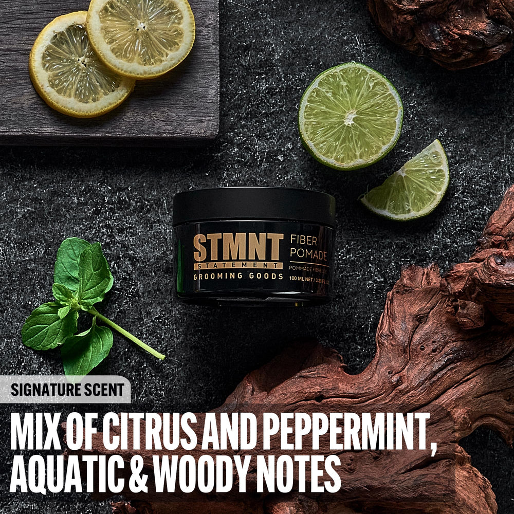 STMNT Fiber Pomade on palm shows pliable texture for separation and remoldable style.