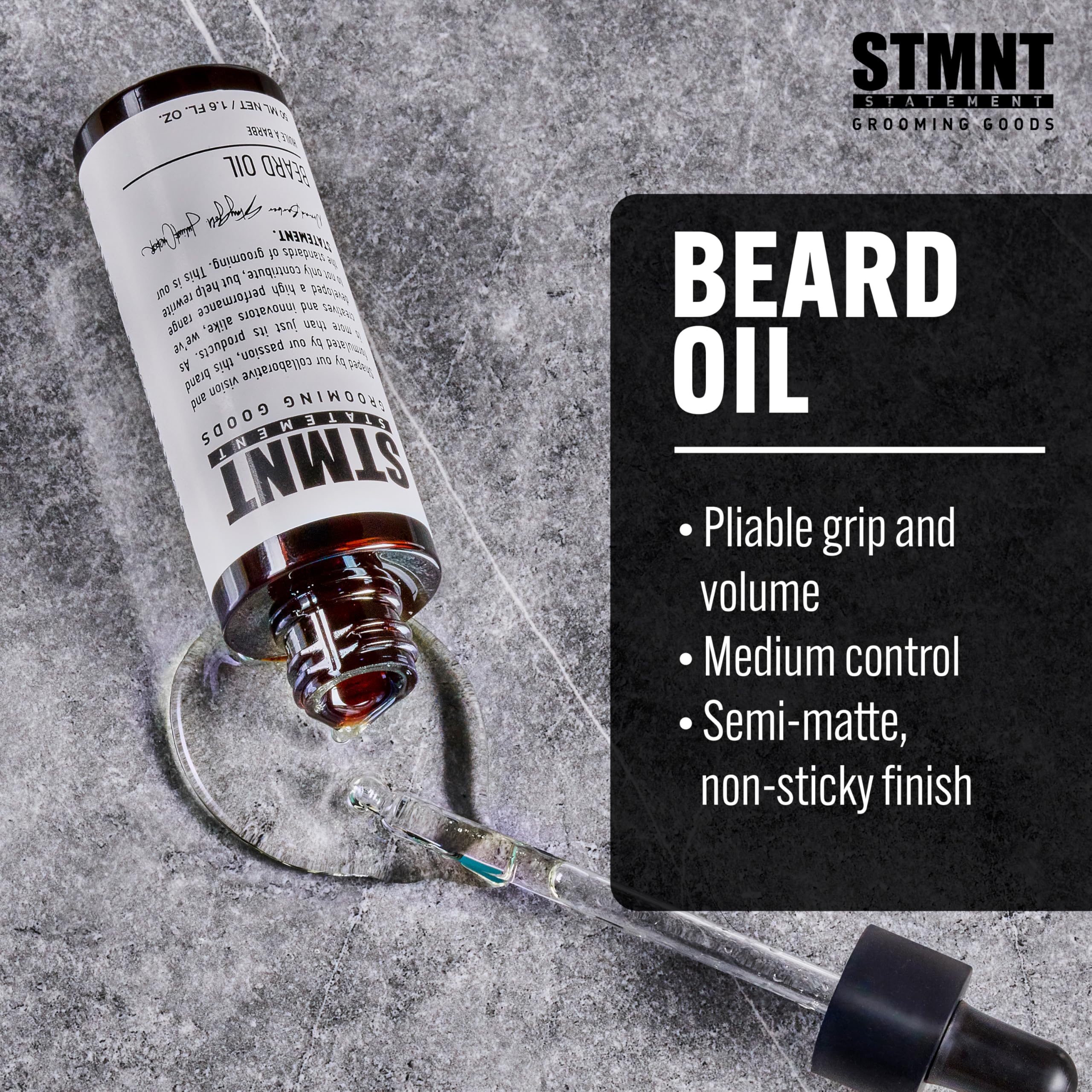 Close-up of STMNT beard oil label highlighting silicone-free formula.