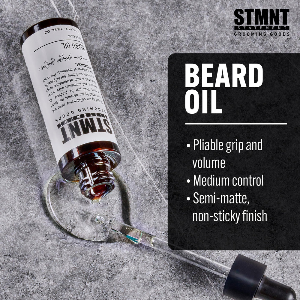 Close-up of STMNT beard oil label highlighting silicone-free formula.