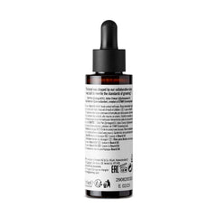 Product packaging for STMNT beard oil on a clean shelf.