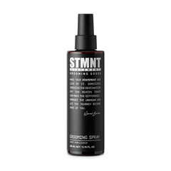 STMNT Grooming Spray in a 6.7 oz bottle for easy styling and light hold.