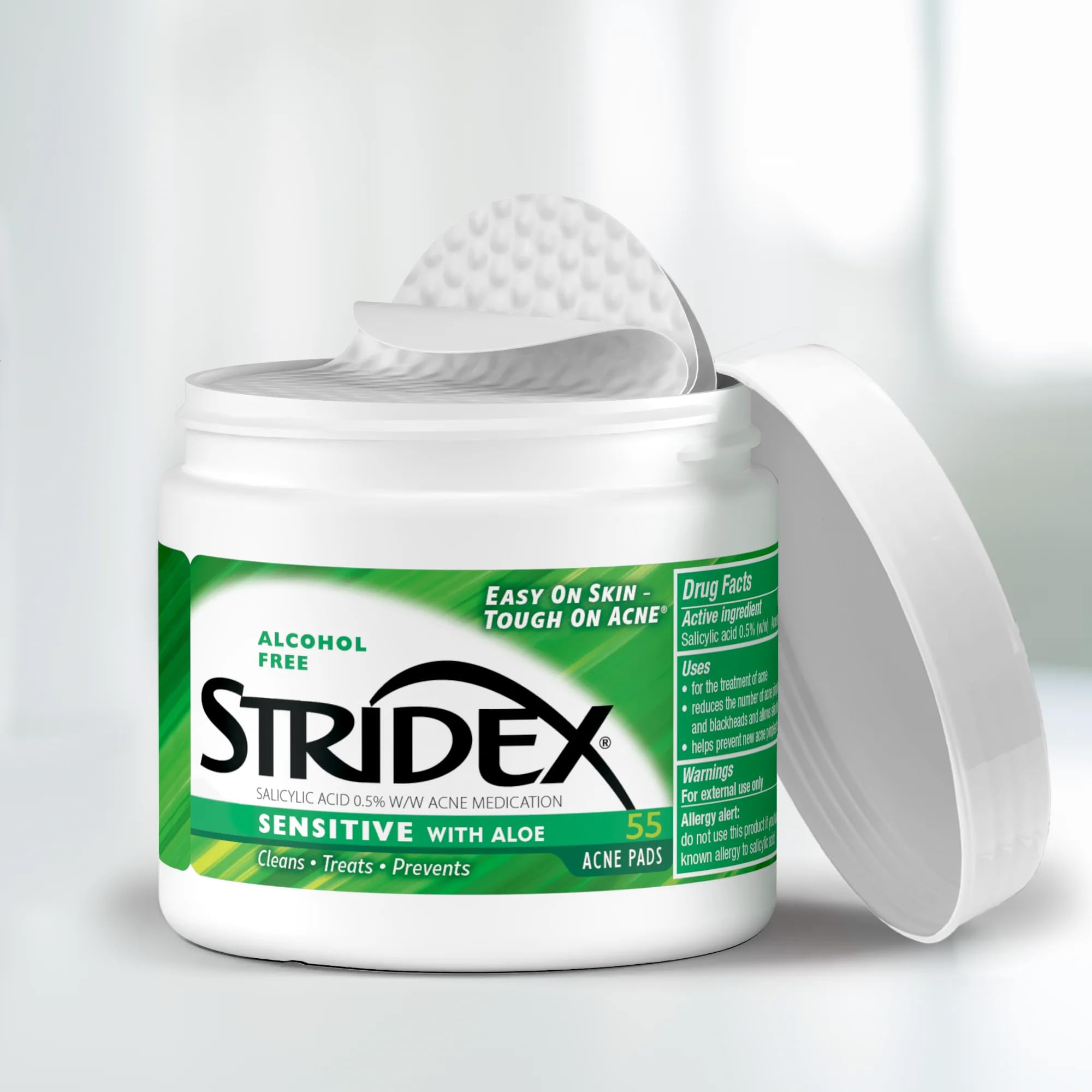 Stridex Sensitive Pads face-application scene showing easy wipe-on use