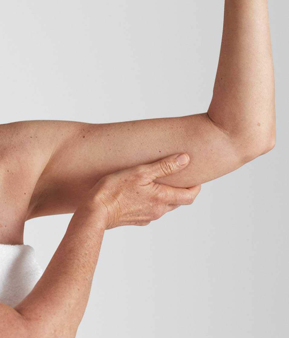 StriVectin leg application demonstrates smoothing and tone improvement on skin.