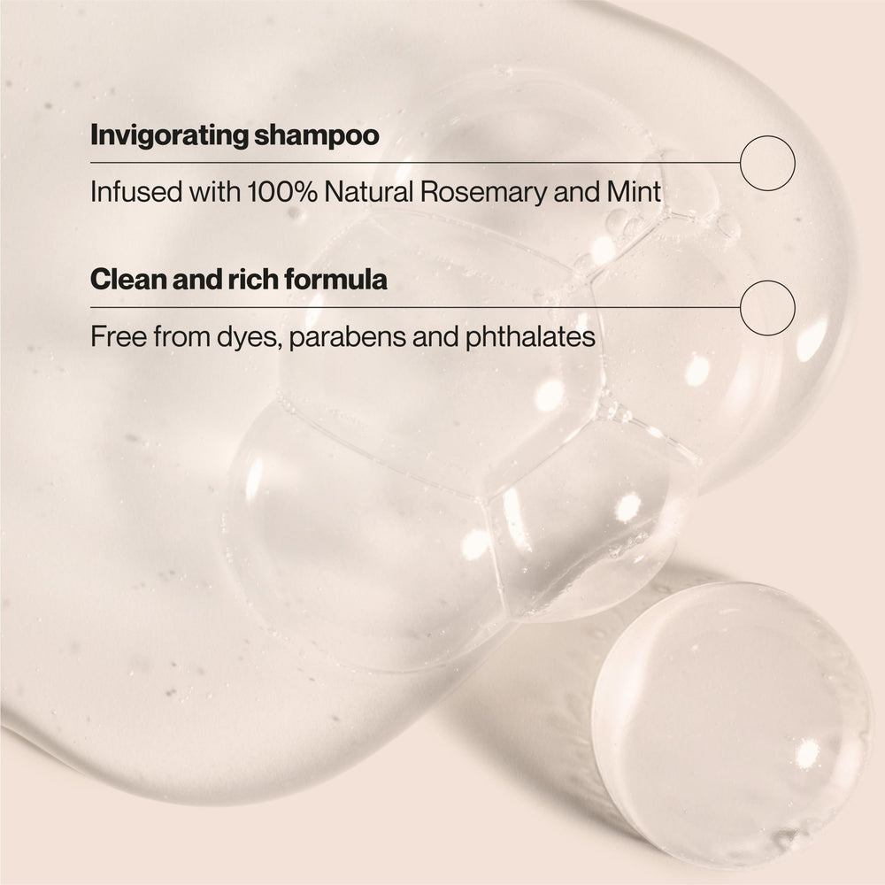 Rosemary sprigs beside Suave Rosemary and Mint shampoo for refreshing scalp care