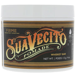 Suavecito Pomade Firme Whisky, frasco visible, aroma intenso para peinados.