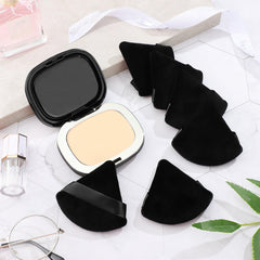 Soft velour texture of Suclain puff touching skin during makeup
