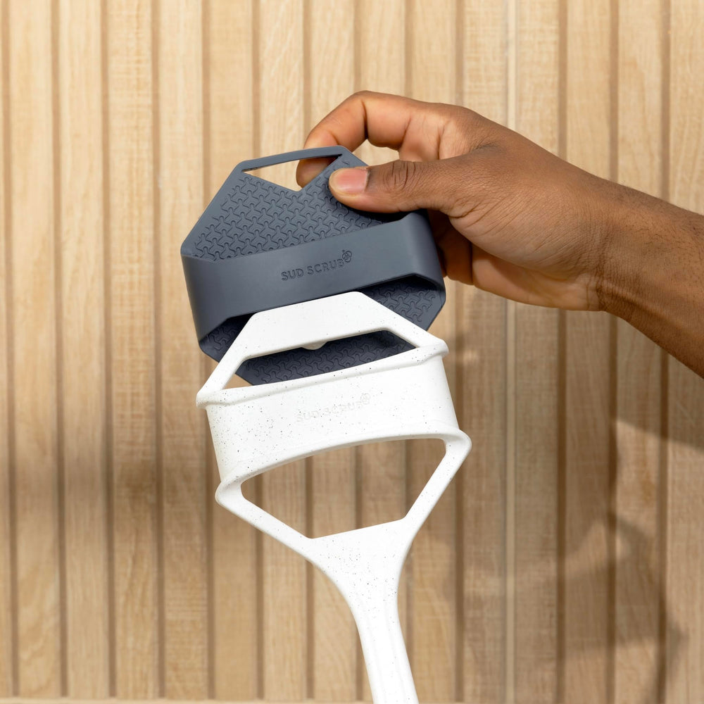 Sud Scrub extender handle in shower scene highlighting back cleaning reach.