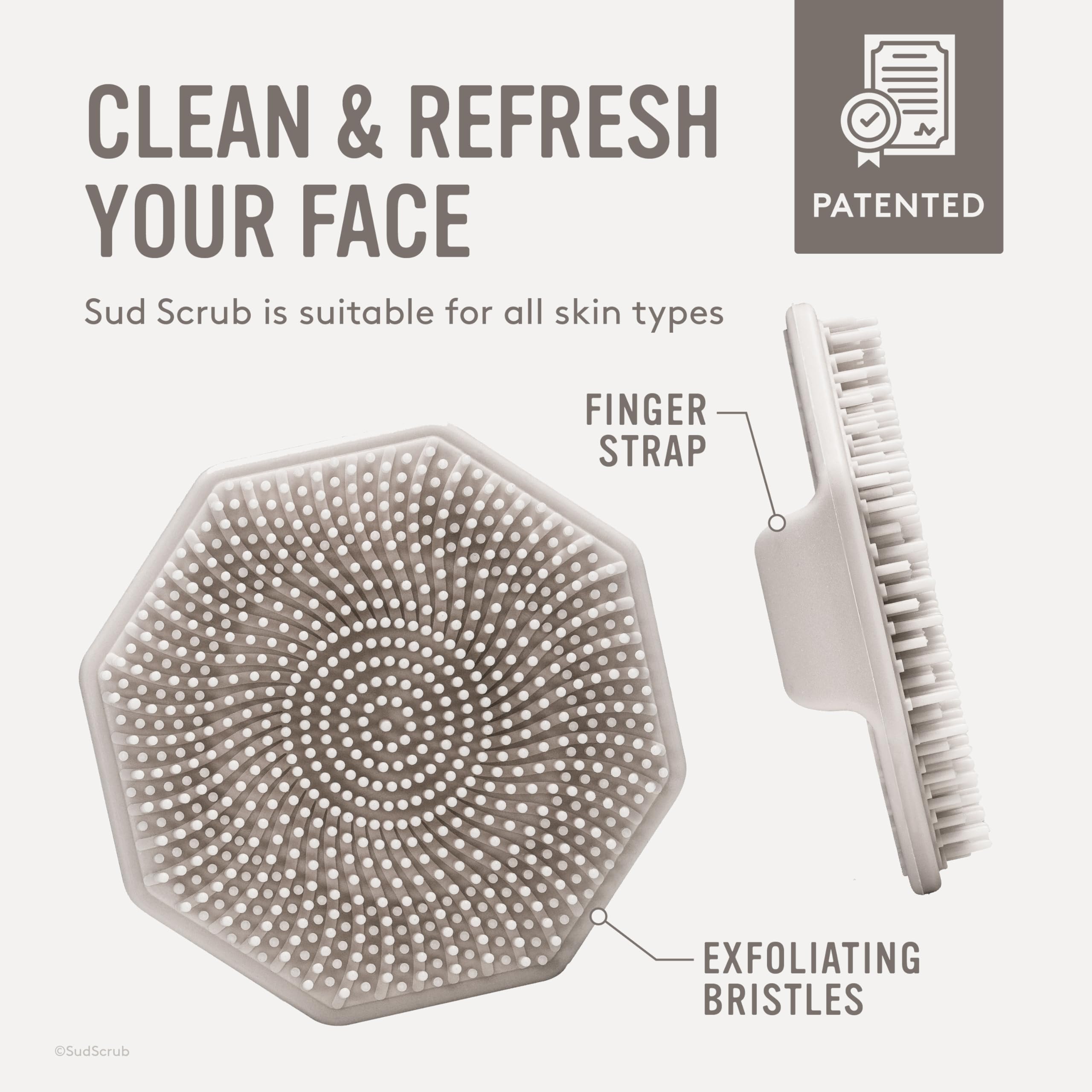 Sud Scrub non-slip grip with ergonomic finger strap for stable cleansing.