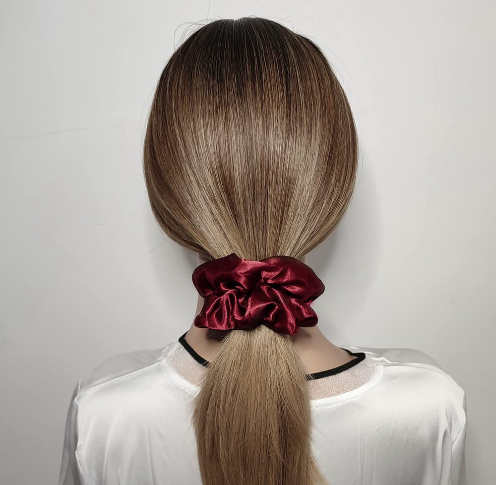 Close-up of Sufermoe satin scrunchies, premium texture and elastic resilience.