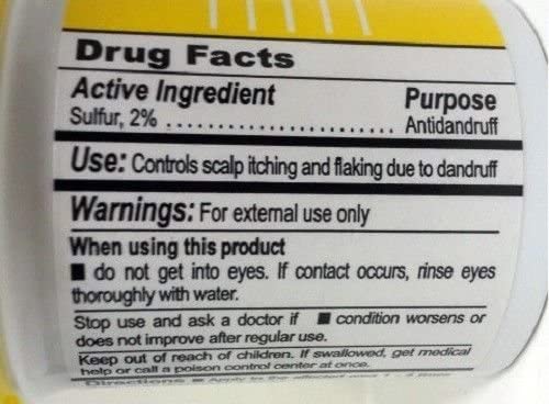 Close-up of SULFUR8 conditioner texture highlighting hydration for smooth hair.