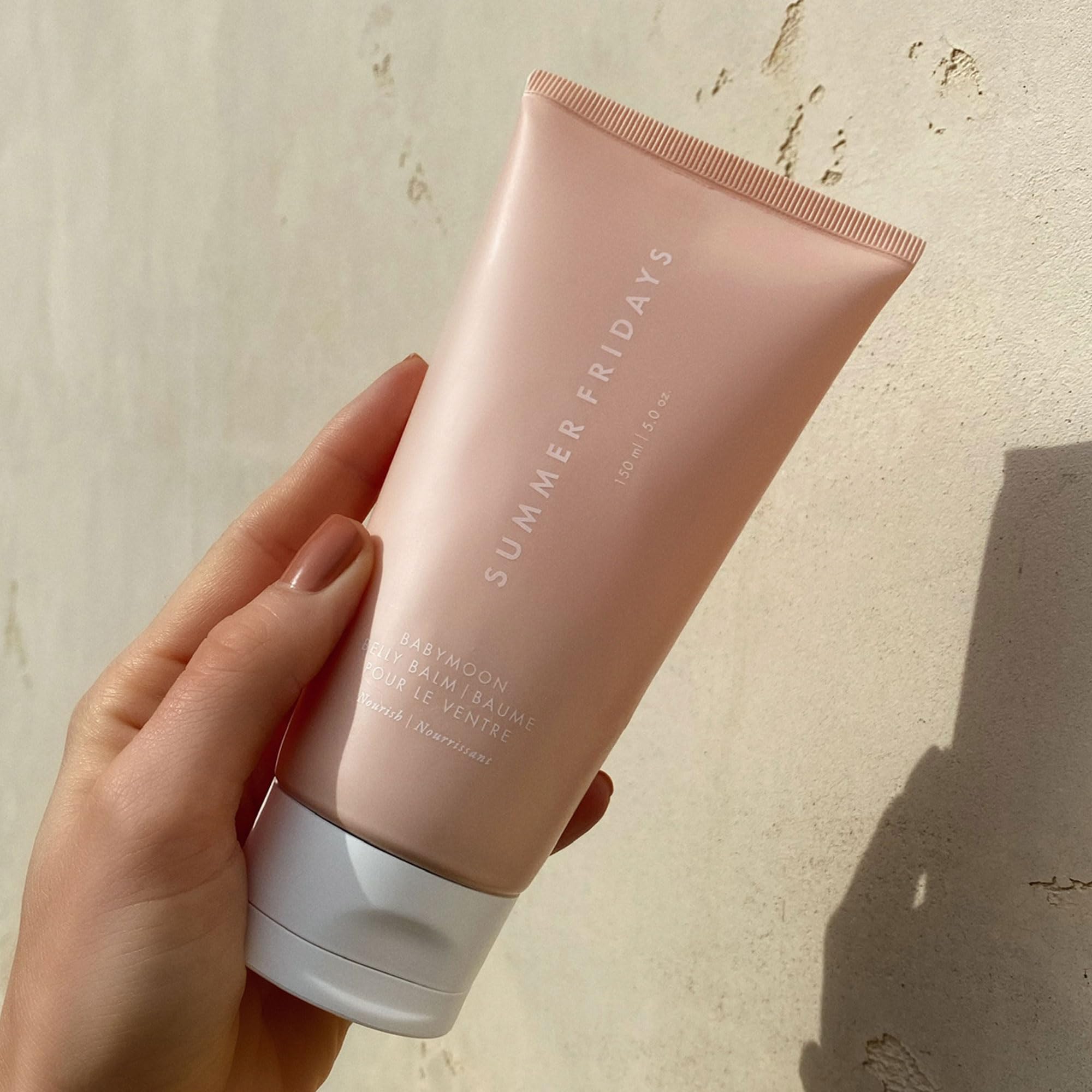 Summer Fridays Babymoon Belly Balm application ready for easy massage and nourishment.