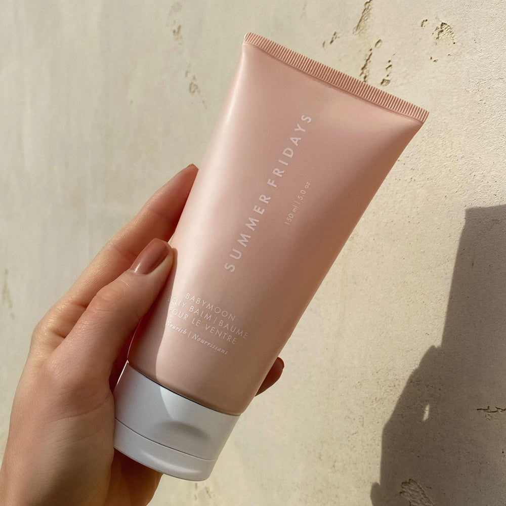 Summer Fridays Babymoon Belly Balm application ready for easy massage and nourishment.